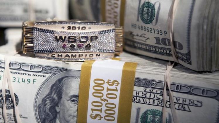 Comprehensive Guide To The World Series Of Poker: Bracelet Worth And More Stacks of 100 Dollar Bills with WSOP bracelet
